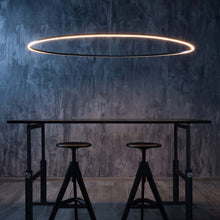 Load image into Gallery viewer, Ellisse LED Mega Pendant Light in restaurant.
