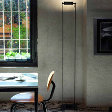 Load image into Gallery viewer, Logo Floor Lamp in living room.
