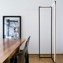 Load image into Gallery viewer, Spigolo LED Floor Lamp in living room.
