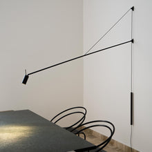 Load image into Gallery viewer, Swan LED Wall Light in living room.
