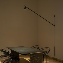 Load image into Gallery viewer, Swan LED Wall Light in living room.
