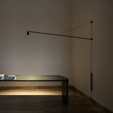 Load image into Gallery viewer, Swan LED Wall Light in living room.
