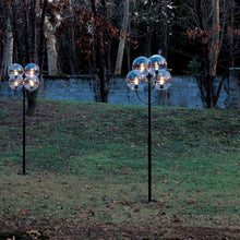 Load image into Gallery viewer, Lyndon Outdoor Floor Lamp in outside area.
