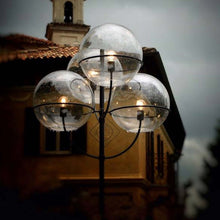 Load image into Gallery viewer, Lyndon Outdoor Floor Lamp in outside area.
