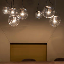 Load image into Gallery viewer, The Globe Pendant Light in dining room.
