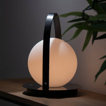 Load image into Gallery viewer, Bola Outdoor LED Lantern in living room.
