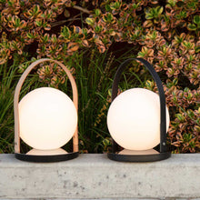 Load image into Gallery viewer, Bola Outdoor LED Lantern in Outside Area.
