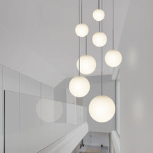 Load image into Gallery viewer, Bola Sphere LED Pendant Light in stairs.
