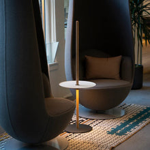 Load image into Gallery viewer, Nivel Pedestal LED Table Lamp in living room.
