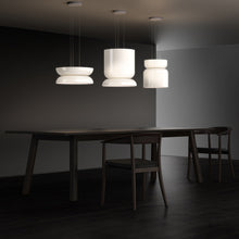 Load image into Gallery viewer, Totem Up/Down LED Pendant Light in living room.
