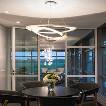 Load image into Gallery viewer, Pirce LED Suspension Light in living room.
