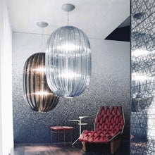 Load image into Gallery viewer, Plass Pendant Light in living room.
