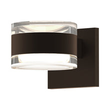 Load image into Gallery viewer, Reals Up/Down Outdoor LED Wall Light in Textured Bronze/Clear Cylinder Lens/Clear Cylinder Lens.
