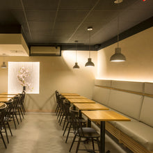 Load image into Gallery viewer, Castle Bell Pendant Light in restaurant.
