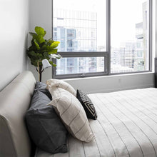 Load image into Gallery viewer, Dobi Table Lamp in bedroom.
