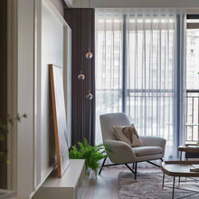 Load image into Gallery viewer, Dora LED Multi Light Pendant Light in living room.
