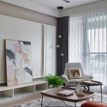 Load image into Gallery viewer, Dora LED Multi Light Pendant Light in living room.
