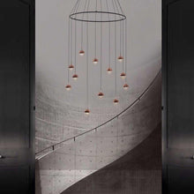 Load image into Gallery viewer, Dora LED Multi Light Ring Pendant Light in stairs.
