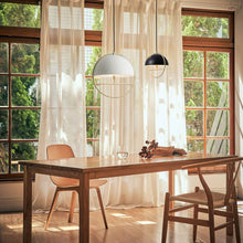 Load image into Gallery viewer, Huan LED Pendant Light in dining room.
