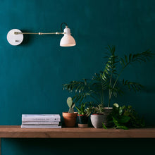 Load image into Gallery viewer, Laito Mini Swing Arm Wall Light in living room.
