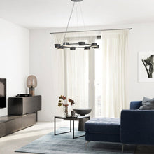 Load image into Gallery viewer, OLO LED Ring Pendant Light in living room.
