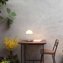Load image into Gallery viewer, Pensee LED Table Lamp in Outside Area.
