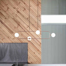 Load image into Gallery viewer, Sircle LED Linear Pendant Light in kitchen.
