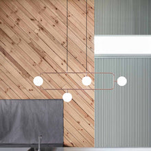 Load image into Gallery viewer, Sircle LED Linear Pendant Light in kitchen.

