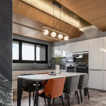 Load image into Gallery viewer, Sircle LED Linear Pendant Light in dining room.
