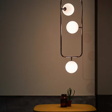 Load image into Gallery viewer, Sircle LED Vertical Pendant Light in living room.
