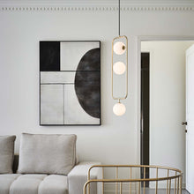 Load image into Gallery viewer, Sircle LED Vertical Pendant Light in living room.
