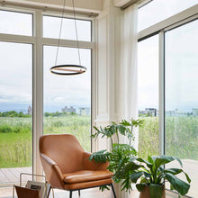 Load image into Gallery viewer, SOL LED Pendant Light in living room.

