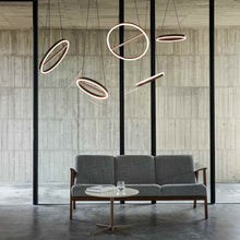 Load image into Gallery viewer, SOL LED Pendant Light in living room.
