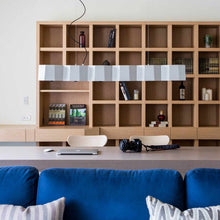 Load image into Gallery viewer, Zhe Linear Pendant Light in living room.
