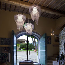 Load image into Gallery viewer, Aria LED Chandelier in living room.
