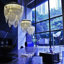Load image into Gallery viewer, Ceremony LED Chandelier in living room.
