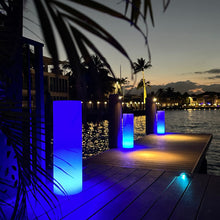 Load image into Gallery viewer, Tower LED Floor Lamp in Outside Area.
