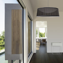 Load image into Gallery viewer, Solis LED Drum Pendant Light in living room.

