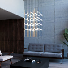 Load image into Gallery viewer, Constellation® Cosmic Cube LED Pendant Light in living room.
