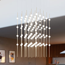 Load image into Gallery viewer, Constellation® Cosmic Cube LED Pendant Light in living room.
