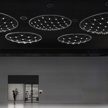 Load image into Gallery viewer, Constellation® Galaxy Matrix Round LED Pendant Light in exhibition.
