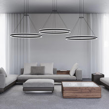 Load image into Gallery viewer, Double Corona™ Ring LED Pendant Light in living room.
