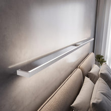 Load image into Gallery viewer, Thin-Line™ LED Wall Light in bedroom.
