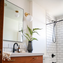 Load image into Gallery viewer, Stella Wall Light in bathroom.
