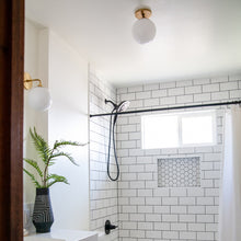 Load image into Gallery viewer, Stella Wall Light in bathroom.
