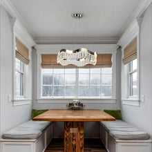 Load image into Gallery viewer, Rolland LED Pendant Light in living room.
