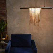 Load image into Gallery viewer, Trapeze LED Linear Pendant light in living room.
