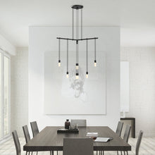 Load image into Gallery viewer, Suspenders® 1-Tier Tri-Bar LED Pendant Light in living room.
