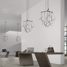 Load image into Gallery viewer, Suspenders® 1-Tier Tri-Bar LED Pendant Light in living room.
