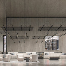 Load image into Gallery viewer, Suspenders® Gridscape LED Pendant Light in living room.
